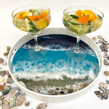 Load image into Gallery viewer, Resin coated white tray with beach theme with waves and real sand and real shells. With carrying handles. 
